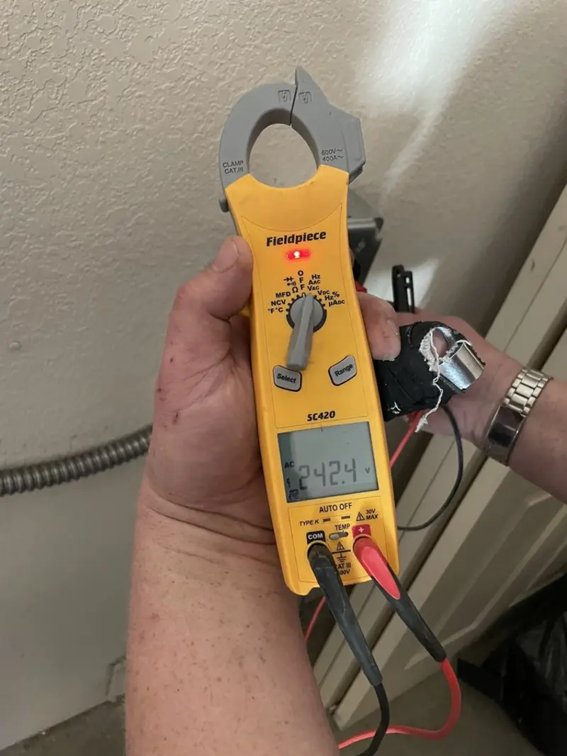Voltage testing with clamp meter during Aluminum Wiring Replacement in Logan